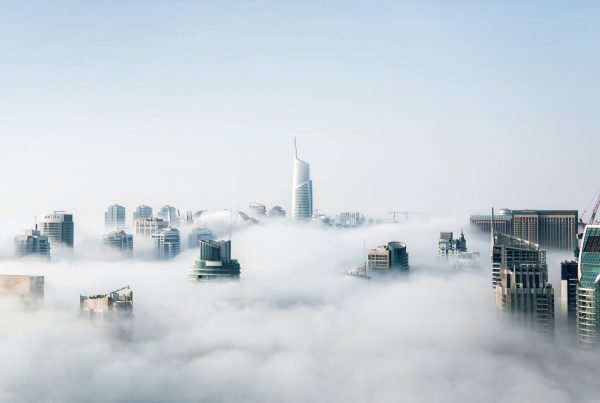 a picture of a skyline on a foggy day