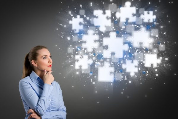 A woman thinking about a puzzle