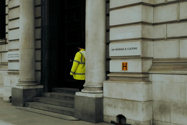 a man in high vis stood outside of HMRC