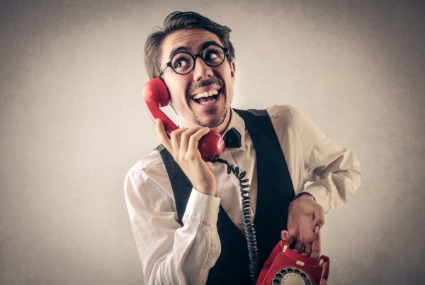 A happy man on the phone